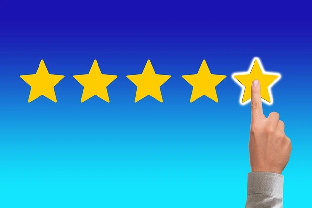 A finger touching a 5 star rating. Customer reviews and testimonials. Highlight positive reviews and testimonials from local customers on your website and social media.